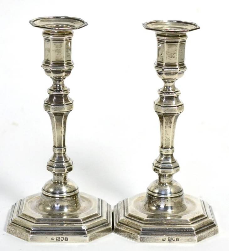 Lot 512 - A pair of Edwardian silver candlesticks of 18th century style, Thomas Bradbury & Sons, London 1904