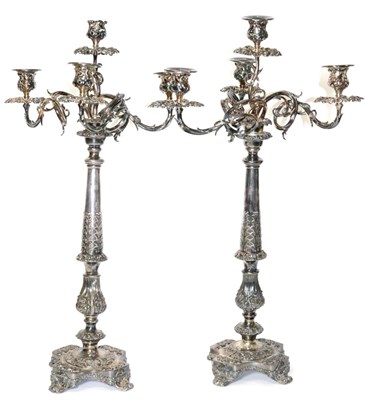 Lot 516 - A pair of impressive Victorian silver plated four light candelabra, the three scrolling foliate...