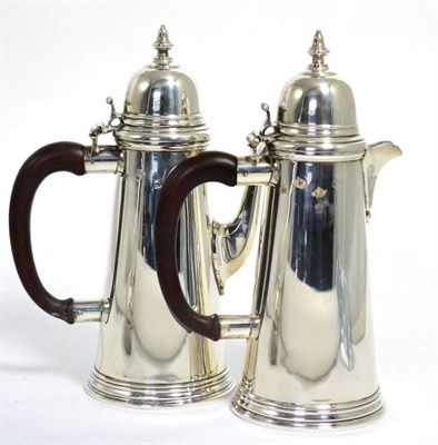 Lot 518 - A pair of Queen Anne style silver cafe au lait pots, John O'Dell, London 1972, plain tapering...