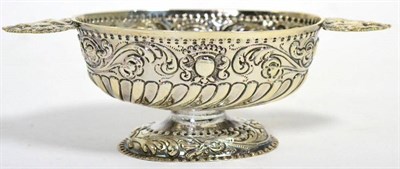 Lot 533 - A silver brandy bowl of Dutch 18th century style, oval on pedestal foot with foliate repoussé...