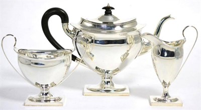 Lot 544 - A three piece silver tea service, Thomas Bradbury & Sons, Sheffield, 1910, of George III style,...