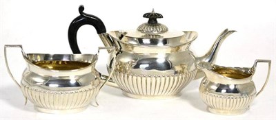 Lot 548 - A Victorian silver three piece tea service, Charles Stuart Harris, London 1895/96, comprising...