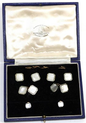 Lot 597 - A cased mother-of-pearl dress set, comprising; a pair of chain linked cufflinks, four buttons...