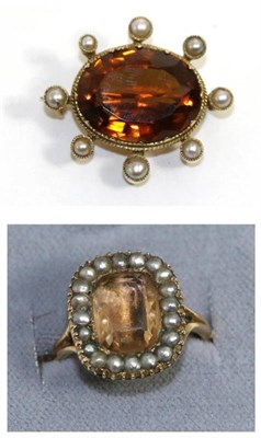 Lot 599 - A citrine and seed pearl brooch, an oval cut citrine in a yellow collet setting within a border...