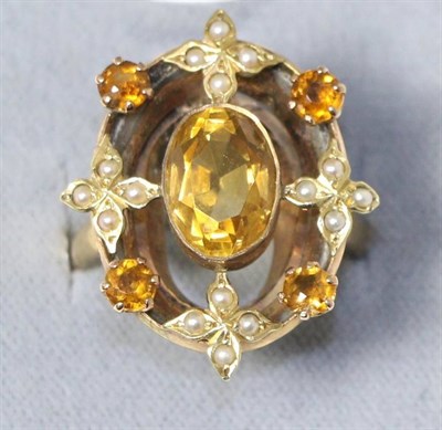 Lot 600 - A citrine and seed pearl ring, an oval cut citrine within a border of round cut citrines...