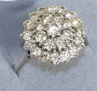 Lot 604 - A diamond and white stone cluster ring, three tiers of round brilliant cut diamonds and one...