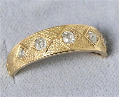 Lot 605 - A diamond band ring, five graduated old cut diamonds in kite settings, to a tapering shank with...