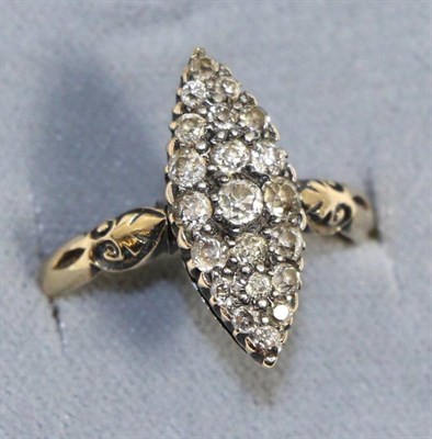 Lot 612 - A diamond navette ring, set throughout with old cut diamonds in white claw settings, to yellow...