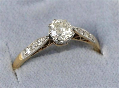 Lot 618 - A diamond solitaire ring, an old cut diamond in a claw setting, to diamond set shoulders, total...