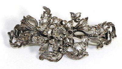 Lot 620 - A diamond spray brooch, a central rose motif cluster amongst leaves and set throughout with...