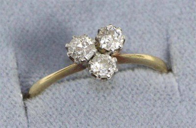 Lot 623 - A diamond three stone ring, old cut diamonds in a clover arrangement, to knife edge shoulders,...