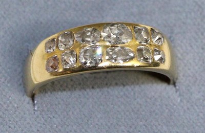 Lot 624 - A diamond two row ring, inset with two rows of old pear cut and old mine cut diamonds to a...