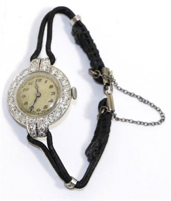 Lot 630 - A lady's diamond set cocktail watch, with lever movement and silvered circular dial with Arabic...