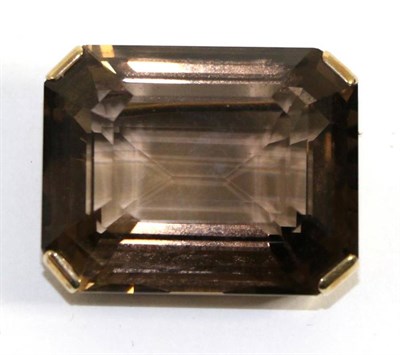 Lot 631 - A large smokey quartz brooch, an octagonal cut smokey quartz in a yellow claw setting above a fancy