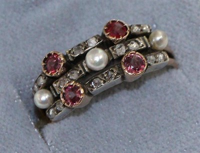 Lot 642 - A pearl, ruby and diamond triple band ring, a central band set with three graduated pearls and...