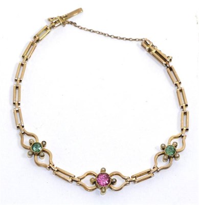 Lot 643 - A pink and green tourmaline and seed pearl bracelet, a round cut pink tourmaline in a yellow...