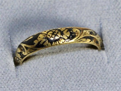 Lot 645 - A Queen Anne mourning ring, a black enamel band picked out with a skull and floral scrolls,...