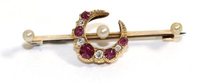 Lot 649 - A ruby, diamond and pearl crescent brooch, alternating round cut rubies and old cut diamonds in...