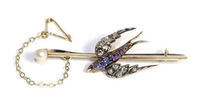 Lot 654 - A sapphire and diamond swallow brooch, with a sapphire set body and rose cut diamond set wings...