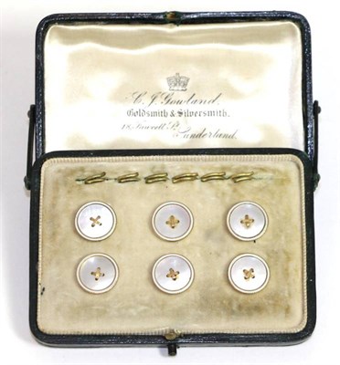 Lot 660 - A set of six mother-of-pearl dress buttons, mother-of-pearl centres with button stitch detail...