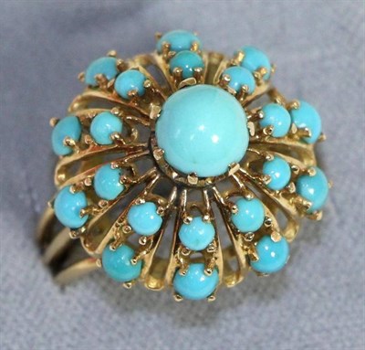 Lot 666 - A turquoise cluster ring, a round cut turquoise within a two tier cluster dome set with...