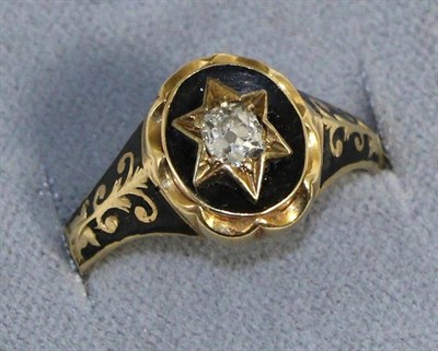 Lot 668 - A Victorian 18 carat gold diamond and enamel mourning ring, an old cut diamond in a yellow star...