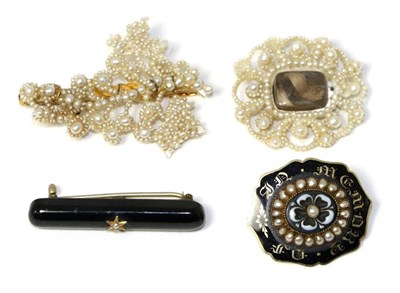 Lot 669 - A Victorian carved onyx, seed pearl and enamel mourning brooch, a floral carved onyx set with a...