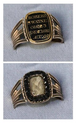 Lot 671 - A Victorian mourning ring, a reversilbe oblong plaque in black enamel picked out to read...