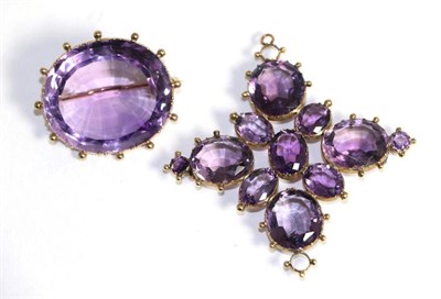 Lot 684 - An amethyst brooch, an oval cut amethyst in a beaded frame, measures 3cm by 3.5cm and an...