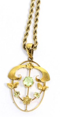 Lot 694 - An Art Nouveau peridot pendant on chain, an openwork pendant with floral detail and set with...