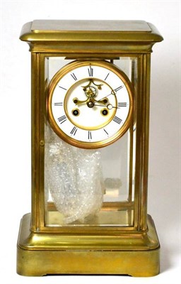 Lot 1307 - A large brass four glass striking mantel clock, circa 1890, four bevelled glass panels, 4-3/4...