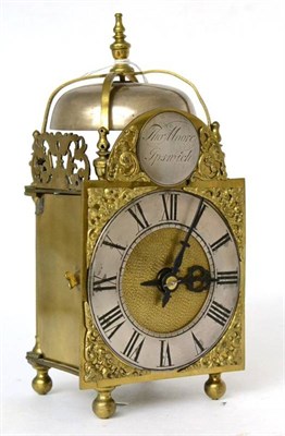 Lot 1315 - A miniature brass striking lantern clock, early 20th century, four posted case, side doors and...