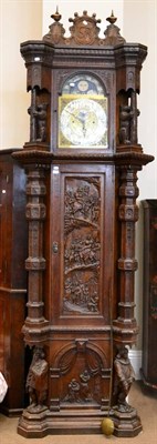 Lot 1319 - An impressive oak chiming longcase clock, circa 1890, hood with carved bear columns, carved...