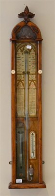 Lot 1321 - An oak Admiral Fitzroy barometer, circa 1890, exposed mercury tube with a double vernier scale,...