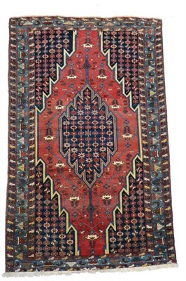 Lot 1336 - A good 19th century Mazlaghan rug, West Iran, the madder field of stylised plants centred by a...