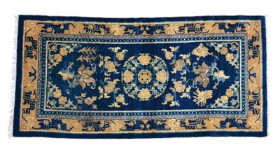 Lot 1343 - A Ningxia rug, North West China, the indigo field with central roundel medallion framed by...