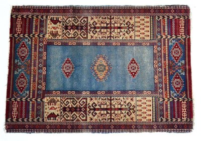 Lot 1350 - An unusual Isparta rug, Central West Anatolia, the plain indigo field with three serrated...