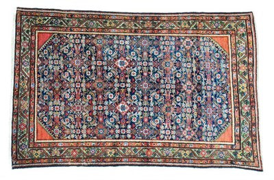 Lot 1359 - Feraghan rug, West Iran, circa 1900, the indigo Herati field framed by madder spandrels and...