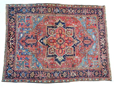 Lot 1360 - Heriz carpet of unusual size, Iranian Azerbaijan, the brick red field of angular vines around a...