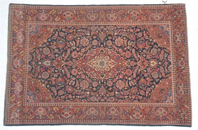 Lot 1364 - Kashan rug, Central Iran, Circa 1930, the indigo field of vines around a cusped pole medallion...