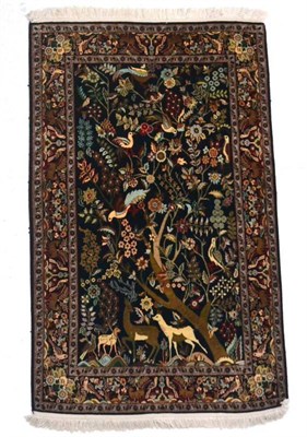 Lot 1367 - Kashmir silk rug, North West India, the indigo field with trees of life birds and animals...