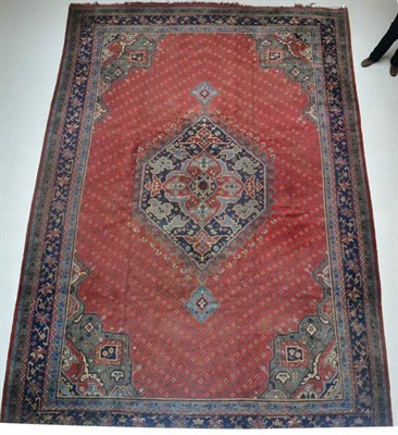 Lot 1369 - Large Ushak carpet, Central West Anatolia, the brick red field centred by an indigo medallion...