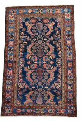 Lot 1372 - Malayir rug, West Iran, circa 1930, the indigo field of stylised plants enclosed by sky blue...