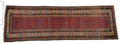 Lot 1373 - Malayir runner, West Iran, the madder field of stylised boteh enclosed by ivory meandering vine...