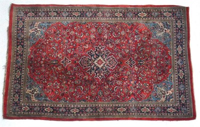 Lot 1381 - Saroukh rug, West Iran, circa 1950, the strawberry field of scrolling vines around an indigo...