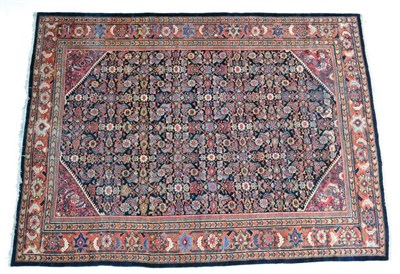 Lot 1383 - Sultanabad carpet, West Iran, circa 1930, the deep indigo field of Herati design framed by...