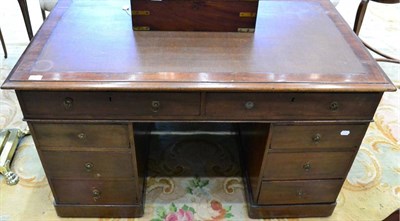 Lot 1401 - ^ A 19th century mahogany double pedestal desk, inset brown leather writing surface above two...