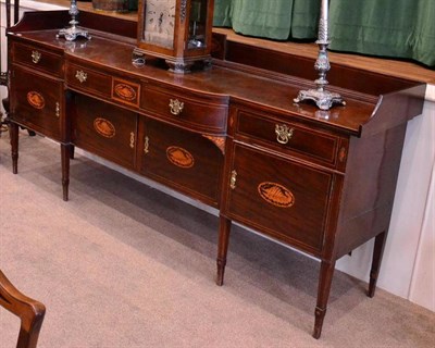 Lot 1403 - A 19th century mahogany sideboard of large proportions, a gallery back above four frieze...