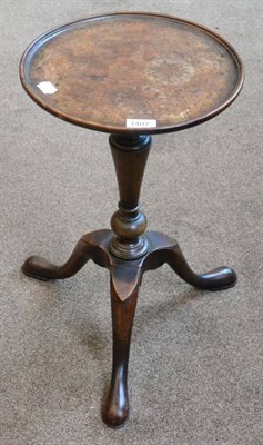 Lot 1407 - A burr walnut tripod stand in George II style, the circular dished top raised on a turned...