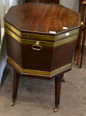 Lot 1425 - A George III mahogany octagonal and brass bound wine cooler, late 18th century, with hinged lid and